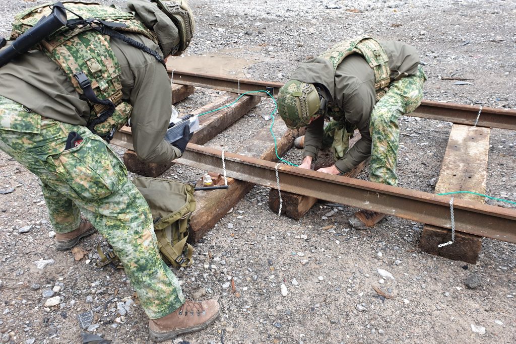Operators engaged in railway demolition training