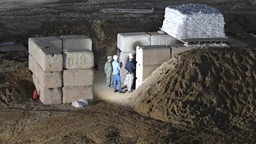 EOD operators secure the area around the uxo at Singapore Airport before neutralising it with Alford Vulcan