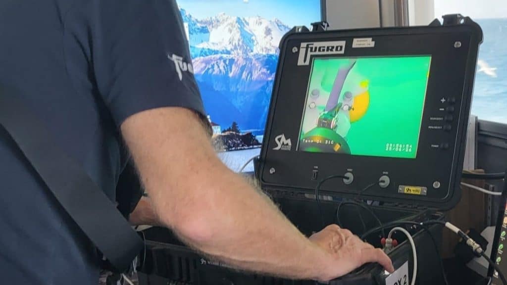 An ROV operator manoeuvring a Buoyant Mine Attachment into position