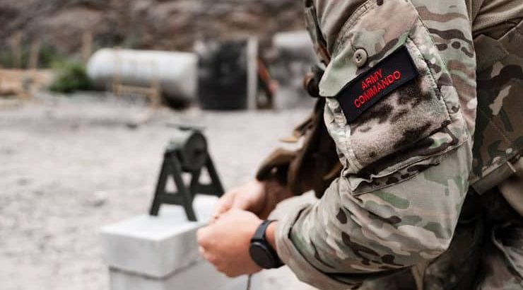 An operator 'detting up' a shoead charge with EFP for demolition training