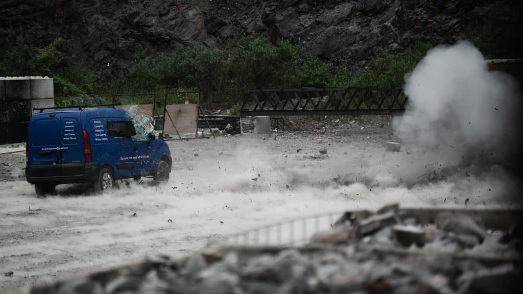 Operators attack a vehicle with a stand-off shaped charge