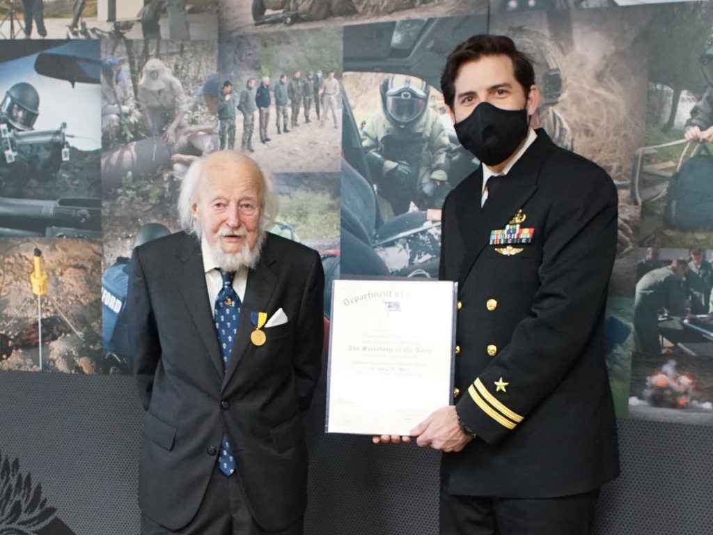 Sidney Alford receives the US Navy Distinguished Public Service Award