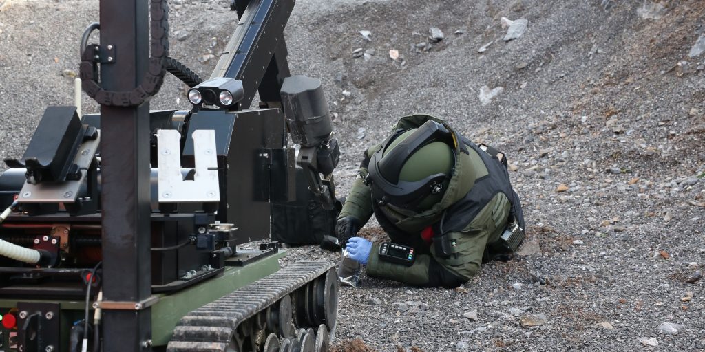 EOD operator and bomb disposal robot