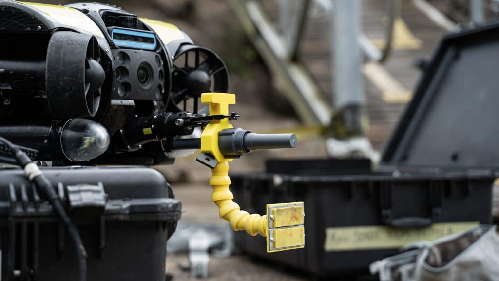 A Deep Trekker ROV preparing to deploy a Vulcan shaped charge using REDS