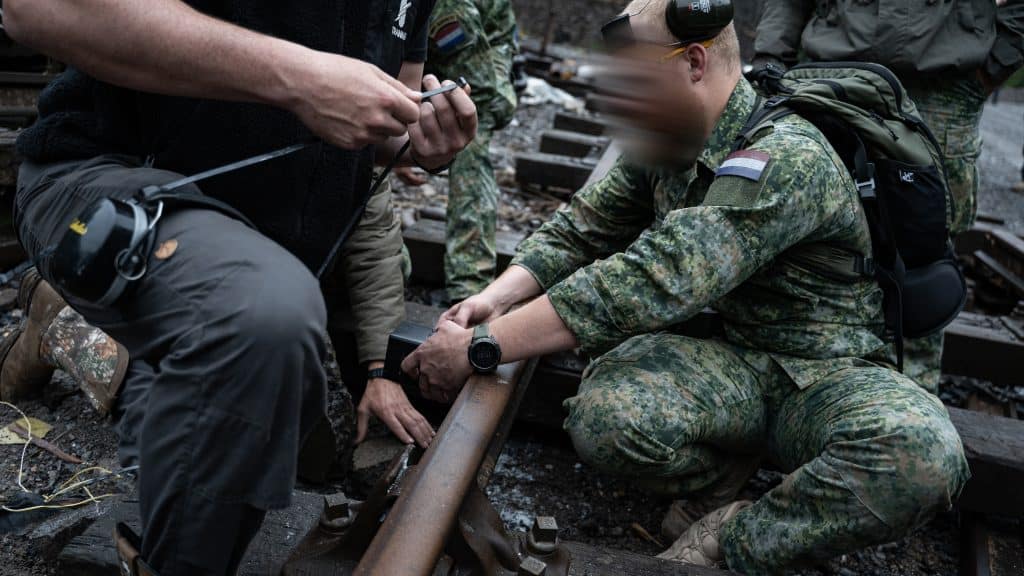 Operators engaged in railway demolition training on an Alford live-fire range