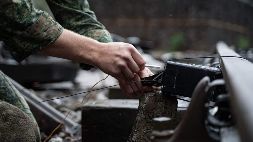 An operator preps a charge during a sabotage course with Alford Training